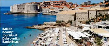  ??  ?? Balkan beauty: Tourists at Dubrovnik’s Banje Beach