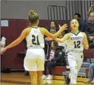  ?? PETE BANNAN — DIGITAL FIRST MEDIA ?? West Chester Rustin’s Becca Magrone (21) gives teammate Olivia Gatto (12) a hand after Gatto hit a 3-pointer in the first half Friday night.