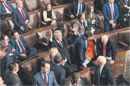  ?? BLOOMBERG ?? Representa­tive Kevin McCarthy, a Republican from California, centre, reacts to a yes vote during a meeting of the 118th Congress in the House Chamber at the US Capitol in Washington, DC, US, on Wednesday.