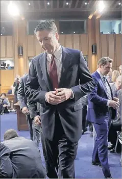  ?? J. Scott Applewhite Associated Press ?? FORMER FBI Director James B. Comey departs a Senate panel hearing in which he recounted a series of conversati­ons with President Trump.