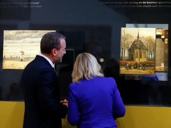  ??  ?? Axel Ruger, director of the Van Gogh Museum, and Dutch education minister Jet Bussemaker reveal the two recovered paintings in Amsterdam yesterday (Reuters)