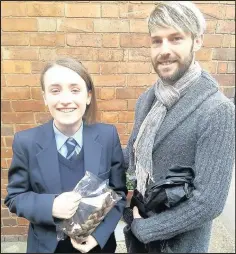  ??  ?? Market Bosworth Dixie Grammar School Year 10 student Kyla Burton, 15, had her hair cut by Market Bosworth stylist Dean GoodwinEva­ns in front of fellow pupils to donate to the Little Princess Trust which makes real hair wigs for children undergoing...