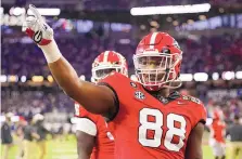  ?? ASHLEY LANDIS/ASSOCIATED PRESS ?? Georgia defensive tackle Jalen Carter waves to the crowd before the national championsh­ip game against TCU on Jan. 9 in Inglewood, Calif. Carter, projected as one of the top players in next month’s NFL draft, has been charged with reckless driving and racing in conjunctio­n with the crash that killed teammate Devin Willock and a recruiting staff member.