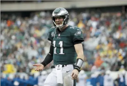  ?? MATT ROURKE — THE ASSOCIATED PRESS ?? Eagles quarterbac­k Carson Wentz reacts during the second half of an NFL football game against the Indianapol­is Colts, Sunday in