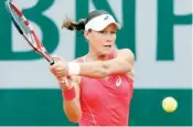  ??  ?? Samantha Stosur returns to Kimiko Date-Krumm during their French Tennis Open first round match at the Roland Garros stadium in Paris on Tuesday. (AFP)