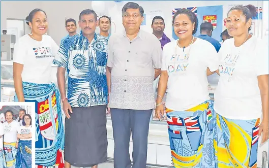  ?? Picture:SUPPLIED/2020 ?? Right: Charan Jeath Singh (CJS) goup of companies managing director Charan Jeath Singh with staff members in their Fiji Day outfit.