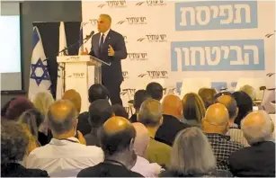  ??  ?? YESH ATID chairman Yair Lapid speaks at a party conference in Tel Aviv yesterday.