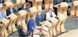  ??  ?? Centre stage Nicola Sturgeon addresses MSPs at First Minister’s Questions but Ms Fabiani says parties often work behind the scenes and are not always point-scoring