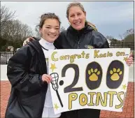  ?? Contribute­d ?? Hand’s Kacie Wines celebrate her 200th point during the Tigers’ win over Simsbury on Saturday.