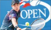  ?? QIN LANG / XINHUA ?? Wu Yibing, 17, became China’s first boys’ Slam singles champ by defeating Argentina’s top-seeded Axel Geller on Sunday.