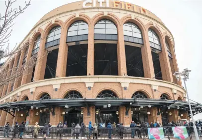  ?? Picture: AFP ?? People wait to enter a Covid-19 vaccinatio­n site at Citi Field yesterday in the Queens borough of New York City. The site will provide vaccinatio­ns to Queens residents, food service workers and taxi drivers.