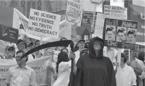  ?? BRUCE CAMPION-SMITH/TORONTO STAR ?? Scientists and academics gathered on Parliament Hill in 2012 to protest Conservati­ve budget cuts they said would devastate science in Canada.