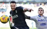  ?? AFP ?? Juventus defender Federico Gatti, left, fights for the ball with Frosinone’s Emanuele Valeri during the match in Turin.