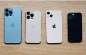  ?? ?? From left to right: iPhone 13 Pro Max in Sierra Blue, iPhone 13 Pro in Gold, iPhone 13 in Pink, and iPhone 13 Mini in Midnight.