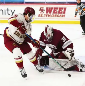  ?? CourteSy oF BoSton college atHleticS ?? ‘LOT OF CONFIDENCE’: UMass goaltender Filip Lindberg stops a scoring chance by Boston College forward Alex Newhook during Friday night’s game. Lindberg made 29 stops for his fourth win of the season.