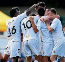  ?? JEREMY WARD/PHOTOSPORT ?? Eastern Suburbs celebrate Matt Palmer’s goal against Hamilton Wanderers.