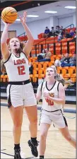  ?? Westside Eagle Observer/RANDY MOLL ?? With Keeley Elsea (No. 40) looking on, Gravette’s Rachel Deihl shoots from below the basket during play against Miami, Okla., in Gravette on Dec. 6.