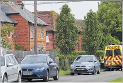  ??  ?? Police on duty at the murder scene in Didcot. Armed officers and dogs were yesterday searching 70 acres of parkland in Oxford