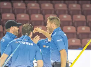  ?? JASON SIMMONDS/JOURNAL PIONEER ?? Skip John Morris, right, and third stone Jim Cotter are about to embrace moments after clinching a berth in the Tim Hortons Roar of the Rings in Ottawa next month. Second stone Catlin Schneider and lead Tyrel Griffith also celebrate.