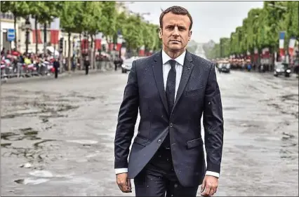  ??  ?? Emmanuel Macron (dimanche, sur les Champs-Elysées) a « une vision très classique » de sa fonction