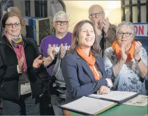  ?? MITCH MACDONALD/THE GUARDIAN ?? Susan MacVittie announces her bid for the NDP P.E.I. leadership while surrounded by party members at Timothy’s World Coffee on Tuesday.