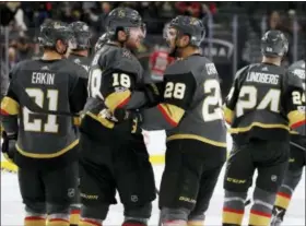  ?? JOHN LOCHER — THE ASSOCIATED PRESS ?? Vegas Golden Knights left wing James Neal (18) and Vegas Golden Knights left wing William Carrier (28) celebrate after they defeated the Chicago Blackhawks in an NHL hockey game Tuesday in Las Vegas.