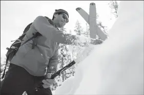  ?? TRIBUNE NEWS SERVICE ?? Bay Area technology lawyer and backcountr­y skier Bill Wang tests the snowpack near Lake Tahoe for weak layers that could cause an avalanche, part of a hands-on safety protocol now getting a boost from rapid technologi­cal advances.