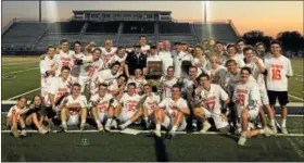  ?? COURTESY PAUL CORTO ?? Chagrin Falls’ boys team poses with its regional title trophy after a 11-10 victory against University at Hudson May 24.