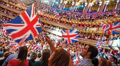  ??  ?? STIRRING STUFF: The audience wave their flags patriotica­lly at the Last Night Of The Proms at the Albert Hall