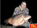  ??  ?? MARK Gray (59) spent a week at Lac Des Lesmont, in France, where he was rewarded with this arm-aching 73lb 2oz mirror. It fell for a 15mm Nash Stawberry Crush pop-up.