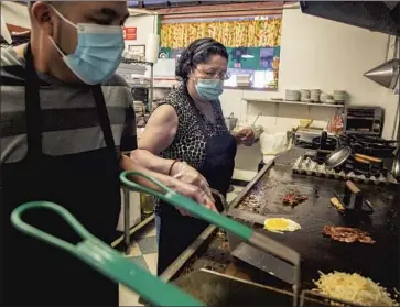  ?? Photog r aphs by Brian van der Brug Los Angeles Times ?? FRANCISCA, right, is a chef at a cafe in Bisbee, Ariz., where she lives. She said wait times to cross the border with Mexico, where her parents live in Naco, Sonora, have increased under pandemic restrictio­ns.