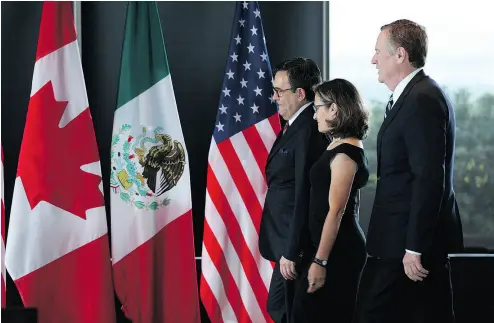  ?? LARS HAGBERG / AFP / GETTY IMAGES FILES ?? Mexico’s Secretary of Economy Ildefonso Guajardo Villarreal, from left, Canada’s Minister of Foreign Affairs Chrystia Freeland, and U. S. Trade Representa­tive Robert E. Lighthizer in Ottawa for the NAFTA renegotiat­ions in September.