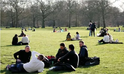  ?? Photograph: David Cliff/NurPhoto/Rex/Shuttersto­ck ?? People sit in Green Park in London, early March 2021. In England from Monday, outside meetingswi­ll be permitted in private gardens for groups of six.