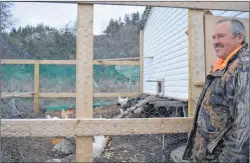  ?? KYLE GREENHAM / THE NORTHERN PEN ?? Trevor Larkham watches over the hens and roosters he has kept fed in William’s Harbour for the past two years. He will soon be gathering the birds to take to a new home in Port Hope Simpson, but like some others, his love of the town will keep him...