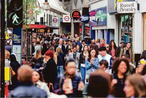  ??  ?? A crowded Oxford Street with commuters and tourists from all over the world. Even months after Britain voted to get out of the EU, investment advisers warn that long-term risks remain in Europe, Britain most of all for businesses and therefore for...