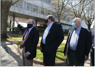  ?? (Arkansas Democrat-Gazette/Thomas Metthe) ?? Investors John Flake (from left), James Hendren and David Payne talk Monday about their plans for the AP&L building in downtown Little Rock.