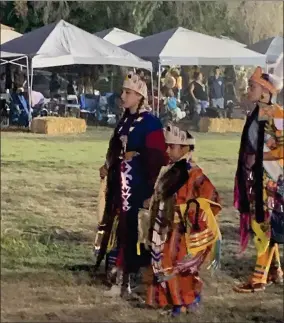  ??  ?? The Tule River 2021 Powwow Senior and Junior Princesses, Aih-nayah Manuel and Sacred Dawn Kaiser, dance down the field Saturday, September 18, 2021 during the Powwow’s Grand Entrance.