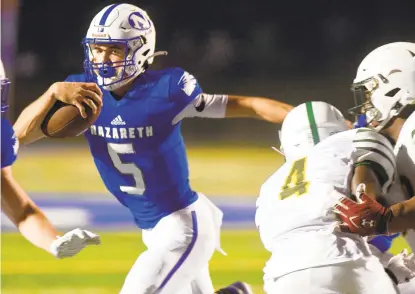  ?? RICKKINTZE­L/THE MORNING CALL ?? Nazareth quarterbac­k Matt Bugbee, 5, scrambles for more yards for the score Friday against Central Catholic during an Eastern Pennsylvan­ia Conference game at Nazareth.