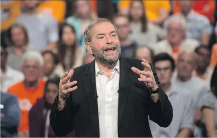  ?? ANDREW VAUGHAN/ THE CANADIAN PRESS ?? NDP Leader Tom Mulcair talks to supporters during a campaign stop in Toronto on Sunday. Mulcair said he plans to “stand up” against the Tories for “saying that we’re going to have two levels of citizenshi­p” when the foreign policy debate unfolds on...