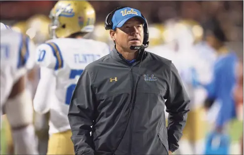  ?? Chris Gardner / Getty Images ?? Former UCLA coach Jim Mora was hired by UConn on Thursday.