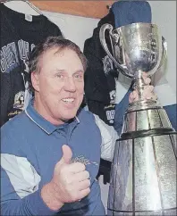  ?? CP PHOTO ?? Baltimore Stallions coach Don Matthews poses with the Grey Cup following his team victory over the Calgary Stampeders in 1995.