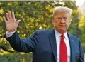  ?? BLOOMBERG NEWS FILE PHOTOS ?? President Donald Trump waves after speaking to members of the media at the White House last week before boarding Marine One while on his way to Europe. Trump said he thought meeting Russian President Vladimir Putin, seen at right at the St. Petersburg Internatio­nal Economic Forum in May, would be the easiest part of his trip.