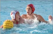  ?? RECORDER PHOTO BY CHIEKO HARA ?? Strathmore High School’s Cotter Ashcraft, right, marks Tulare Western High School’s Ty Benas Wednesday, during the second half of a game in the opening round of the CIF Central Section Division III playoffs at Strathmore.