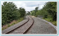  ??  ?? The cost of constructi­ng the bridge in the distance across the M56 almost led to the full closure of the Halton Curve in the early 1970s, but now the route’s new hourly passenger service is expected to eliminate 170,000 car journeys each year from...