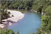  ?? Tulsa World via AP, File ?? The Illinois River as seen from Goat’s Bluff at the J.T. Nickel Family Nature and Wildlife Preserve in Cherokee County, Okla., on July 18, 2019. A federal judge is giving Oklahoma and nearly a dozen poultry companies, including the world’s largest poultry producer, Tyson Foods, an additional 90 days to reach an agreement on plans to clean a watershed polluted by chicken litter.