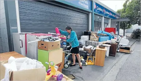  ?? Photo: DEAN KOZANIC/FAIRFAX NZ ?? Christmas eyesore: Piles of unwanted junk have accumulate­d outside Rangiora’s Salvation Army Family Store over the holiday period.