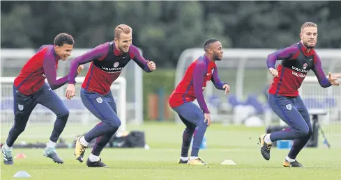  ?? AFP ?? England players, from left, Dele Alli, Harry Kane, Raheem Sterling and Jordan Henderson take part in a training session at Tottenham’s training ground in north London.