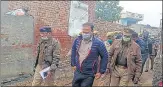  ?? HT ?? Bulandshah­r DM Ravindra Kumar and SSP SK Singh during their visit to the village.