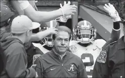  ?? Kevin C. Cox / Getty Images ?? Alabama head coach Nick Saban leads his team on the field prior to their game against Auburn Nov. 25, 2017, at Jordan Hare Stadium in Auburn, Ala.