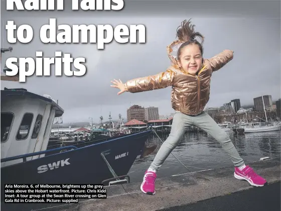  ?? ?? Aria Moreira, 6, of Melbourne, brightens up the grey skies above the Hobart waterfront. Picture: Chris Kidd Inset: A tour group at the Swan River crossing on Glen Gala Rd in Cranbrook. Picture: supplied